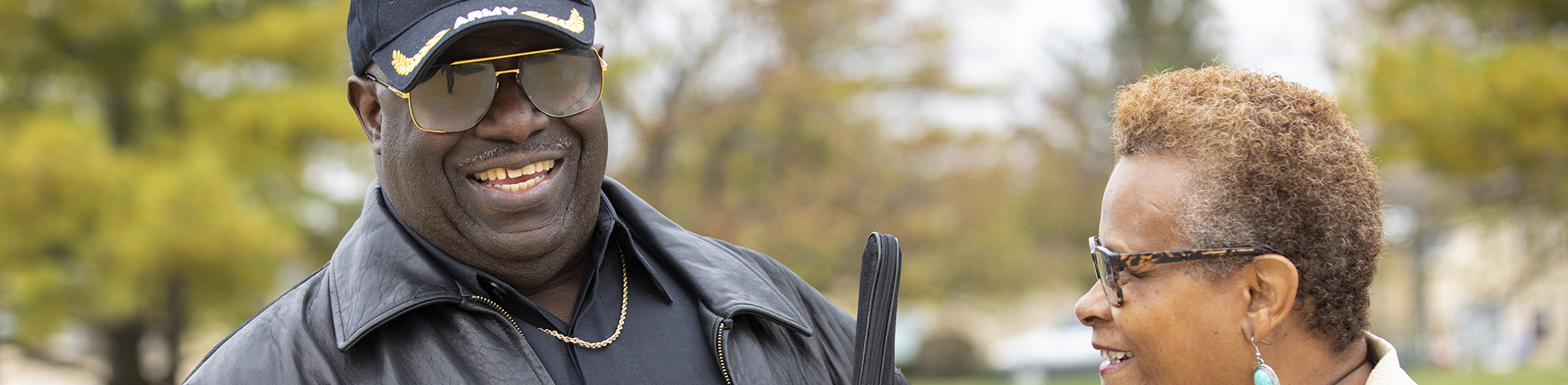 A blind US Army veteran smiles with his wife.